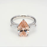 3.00 ct Pear shape Fancy Pink Diamond ring with 2 side diamonds