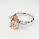 3.00 ct Pear shape Fancy Pink Diamond ring with 2 side diamonds