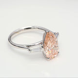 3.00 ct Pear shape Fancy Pink Diamond ring with 2 side diamonds