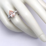 3.00 ct Pear shape Fancy Pink Diamond ring with 2 side diamonds
