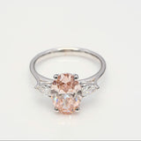 3.00 ct Oval shape Fancy Pink Diamond ring with 2 side diamonds