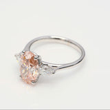 3.00 ct Oval shape Fancy Pink Diamond ring with 2 side diamonds