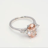 3.00 ct Oval shape Fancy Pink Diamond ring with 2 side diamonds
